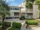 Condo building exterior showcasing landscaping and private patio at 311 E Morse Blvd # 7-2, Winter Park, FL 32789