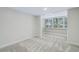 Bright bedroom with grey carpet and window seat at 311 E Morse Blvd # 7-2, Winter Park, FL 32789