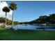 Refreshing community pool with grassy areas and benches at 531 Rhodes Dr, Deland, FL 32720