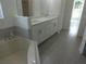 Primary bathroom with double vanity and corner soaking tub at 531 Rhodes Dr, Deland, FL 32720