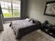 Bright bedroom with lake view and plush carpet at 5525 Pga Blvd # 4614, Orlando, FL 32839