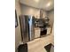 Modern kitchen with stainless steel appliances and granite countertops at 5525 Pga Blvd # 4614, Orlando, FL 32839