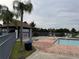 Refreshing community pool with adjacent bathhouse and lake view at 5525 Pga Blvd # 4614, Orlando, FL 32839