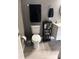 Clean bathroom with toilet, floating shelves, and stylish decor at 5525 Pga Blvd # 4614, Orlando, FL 32839