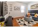 Entertainment room with large TV, comfy seating, and themed decor at 333 Navarra Ln, Davenport, FL 33837