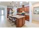 Spacious kitchen with granite countertops, stainless steel appliances, and an island at 333 Navarra Ln, Davenport, FL 33837