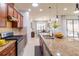 Modern kitchen with granite countertops and stainless steel appliances at 333 Navarra Ln, Davenport, FL 33837