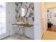 Modern entryway with geometric wallpaper and a stylish console table at 333 Navarra Ln, Davenport, FL 33837
