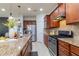 Modern kitchen with granite countertops and stainless steel appliances at 333 Navarra Ln, Davenport, FL 33837