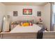 Bright bedroom with wood floors, a comfortable bed, and stylish decor at 333 Navarra Ln, Davenport, FL 33837