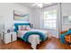 Cozy bedroom featuring teal accents and wood flooring at 333 Navarra Ln, Davenport, FL 33837
