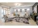 Spacious living room with a white sectional sofa and geometric rug at 333 Navarra Ln, Davenport, FL 33837