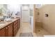 Elegant bathroom with double vanity, large shower, and granite counters at 333 Navarra Ln, Davenport, FL 33837
