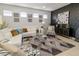 Modern living room featuring white sectional sofa and accent chairs at 333 Navarra Ln, Davenport, FL 33837
