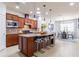 Open concept kitchen with large island and granite countertops at 333 Navarra Ln, Davenport, FL 33837