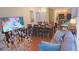 Bright living room with hardwood floors, comfortable seating, and large TV at 4011 Venetian Bay Dr # 101, Kissimmee, FL 34741