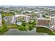 Aerial view of condo complex near a lake and other amenities at 6165 Carrier Dr # 1214, Orlando, FL 32819