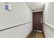 Hallway leading to condo unit with simple flooring and walls at 6165 Carrier Dr # 1214, Orlando, FL 32819