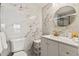 Modern bathroom with marble tile and gold fixtures at 6165 Carrier Dr # 1214, Orlando, FL 32819