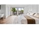 Spacious bedroom with king-size bed and balcony access at 6165 Carrier Dr # 1214, Orlando, FL 32819