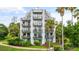 Exterior view of condo building showcasing multiple balconies at 6165 Carrier Dr # 1214, Orlando, FL 32819