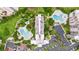Aerial view of community with pools and landscaping at 6165 Carrier Dr # 1214, Orlando, FL 32819