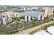 Complex with multiple buildings, pools, and parking near a lake at 6165 Carrier Dr # 1214, Orlando, FL 32819