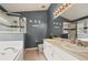 Bathroom with a large soaking tub, double vanity, and gray walls at 619 Kensington Dr, Davenport, FL 33897