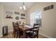 Bright dining room featuring a wood table and chairs, and decorative wall art at 619 Kensington Dr, Davenport, FL 33897