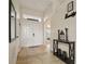 Inviting entryway with tile flooring and a console table at 619 Kensington Dr, Davenport, FL 33897