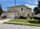 Two-story house with arched entryway and landscaping at 633 Copeland Dr, Haines City, FL 33844