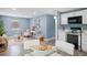 Modern kitchen with white cabinets and stainless steel appliances at 143 Bob Thomas Cir, Sanford, FL 32771