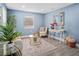 Light and airy living room with stylish decor and hardwood floors at 143 Bob Thomas Cir, Sanford, FL 32771