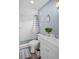 Clean bathroom with a shower/tub combo and gray-striped shower curtain at 143 Bob Thomas Cir, Sanford, FL 32771