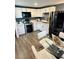 Modern kitchen with white cabinets, stainless steel appliances, and quartz countertops at 143 Bob Thomas Cir, Sanford, FL 32771