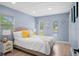 Bright bedroom with a queen bed, and neutral color palette at 143 Bob Thomas Cir, Sanford, FL 32771