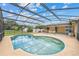 Kidney-shaped pool with screened enclosure at 274 N Ranger Blvd, Winter Park, FL 32792