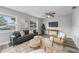 Spacious living room with a modern sofa set and a large TV at 274 N Ranger Blvd, Winter Park, FL 32792