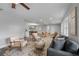 Living room with grey couch and armchairs near dining area at 274 N Ranger Blvd, Winter Park, FL 32792