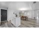 Bright dining area features a kitchen island and stylish light fixture at 274 N Ranger Blvd, Winter Park, FL 32792