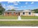 Newly renovated brick and stucco ranch home with a well-maintained lawn at 274 N Ranger Blvd, Winter Park, FL 32792