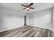 Simple bedroom with wood flooring and ceiling fan at 274 N Ranger Blvd, Winter Park, FL 32792