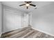 Well-lit bedroom with double doors and ceiling fan at 274 N Ranger Blvd, Winter Park, FL 32792