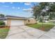 House exterior with a single car garage and well-maintained lawn at 274 N Ranger Blvd, Winter Park, FL 32792