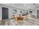 Living room with modern decor, featuring a seating area near the entrance at 274 N Ranger Blvd, Winter Park, FL 32792