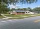 Ranch-style home with a large yard and driveway at 274 N Ranger Blvd, Winter Park, FL 32792