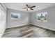 Spacious bedroom with new wood flooring and two windows at 274 N Ranger Blvd, Winter Park, FL 32792