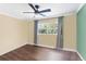 Light and airy bedroom with wood flooring at 515 N Boyd St, Winter Garden, FL 34787