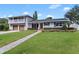 Two-story home with gray brick, updated garage doors, and a paved walkway at 515 N Boyd St, Winter Garden, FL 34787