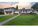 Two-story home with gray brick, updated garage doors, and a paved walkway at 515 N Boyd St, Winter Garden, FL 34787